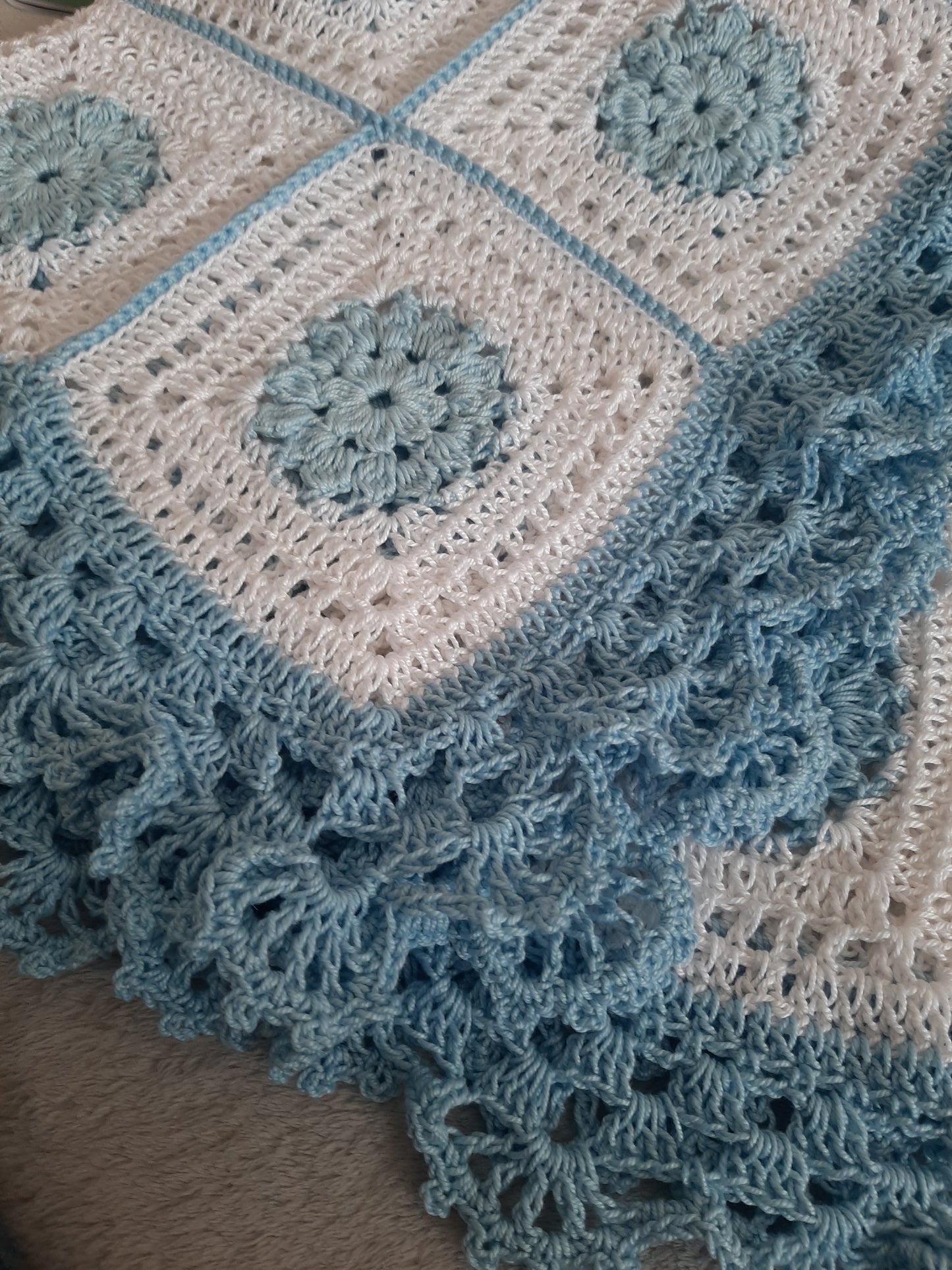 Handcrafted crochet white and blue cotton baby blanket