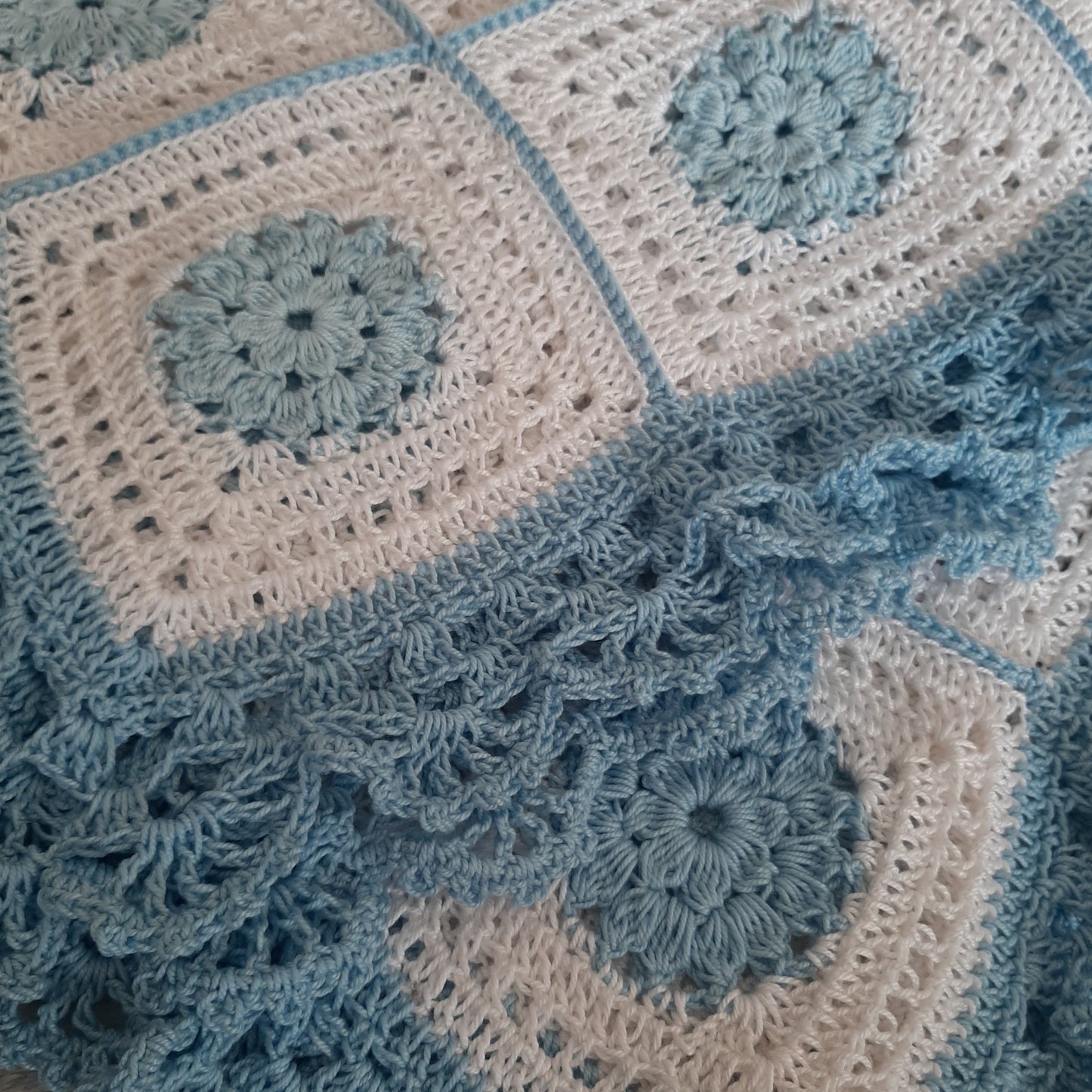 Handcrafted crochet white and blue cotton baby blanket