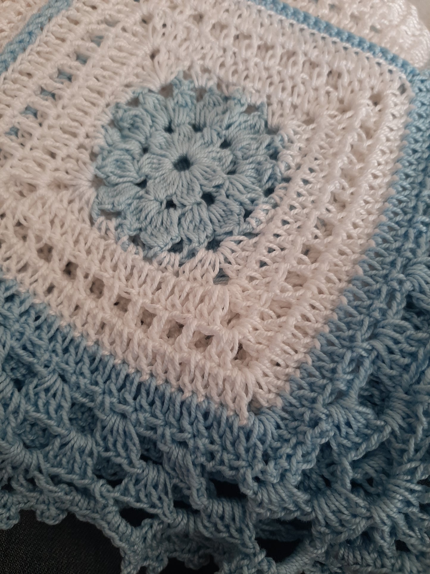 Handcrafted crochet white and blue cotton baby blanket