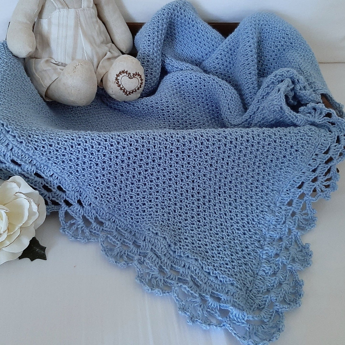 Honeycomb knitted baby blanket with handmade crochet lace, light blue