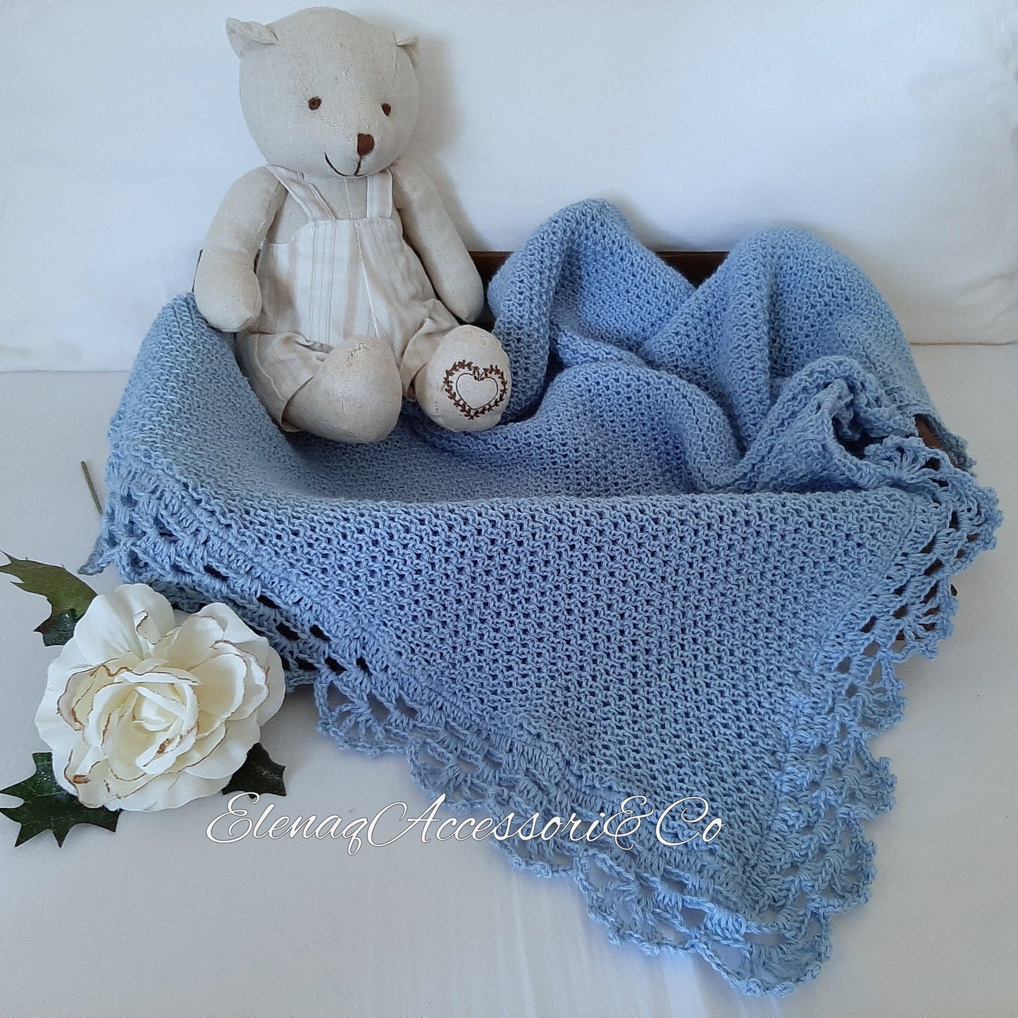 Honeycomb knitted baby blanket with handmade crochet lace, light blue