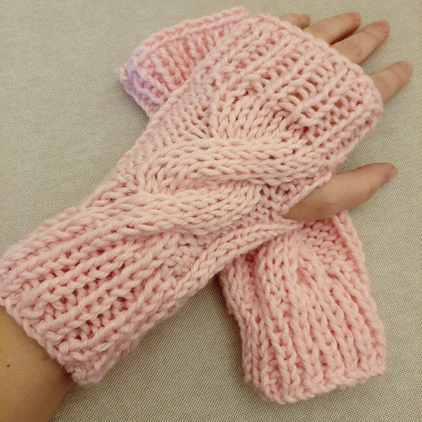 Hand-knitted fingerless braided gloves. Pink