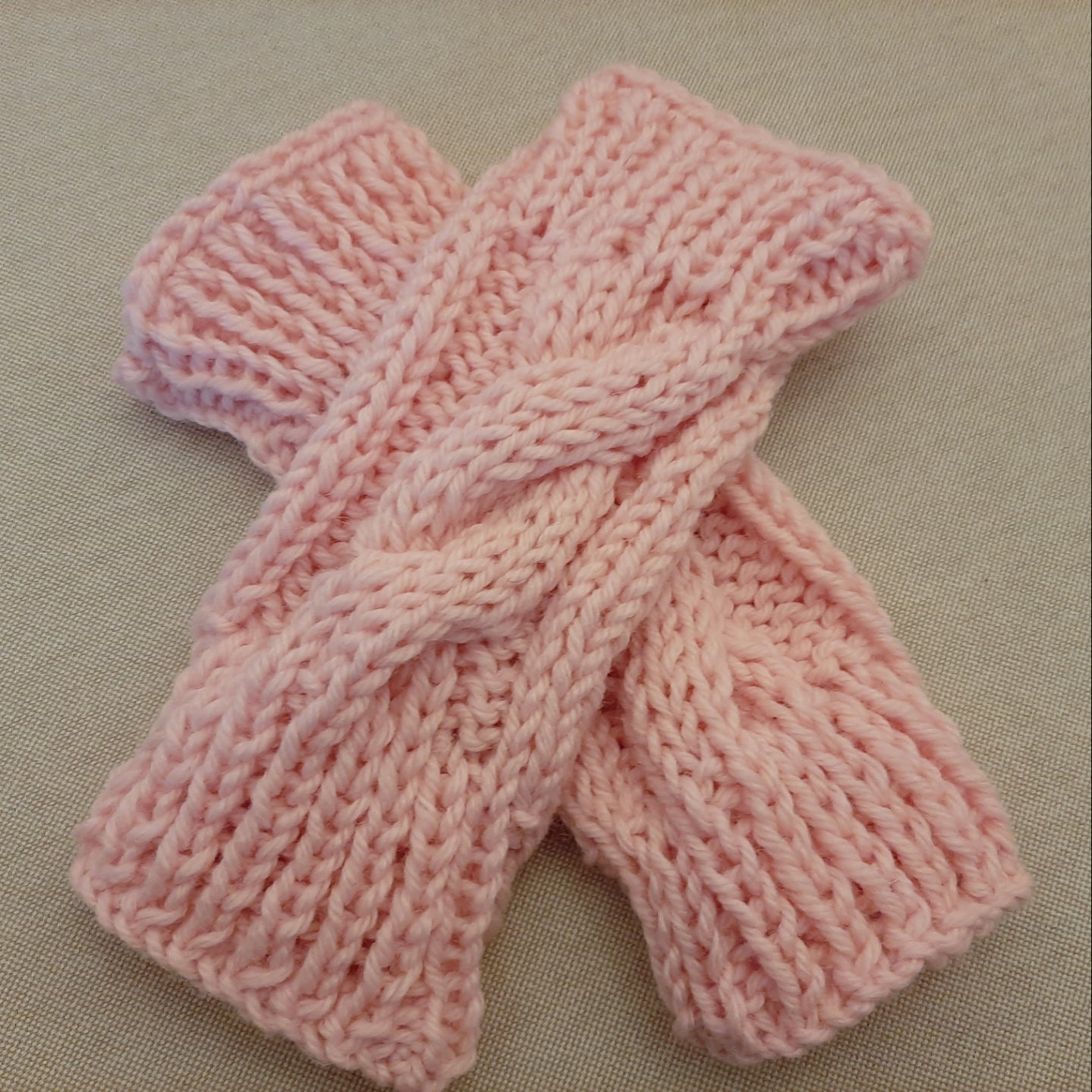 Hand-knitted fingerless braided gloves. Pink