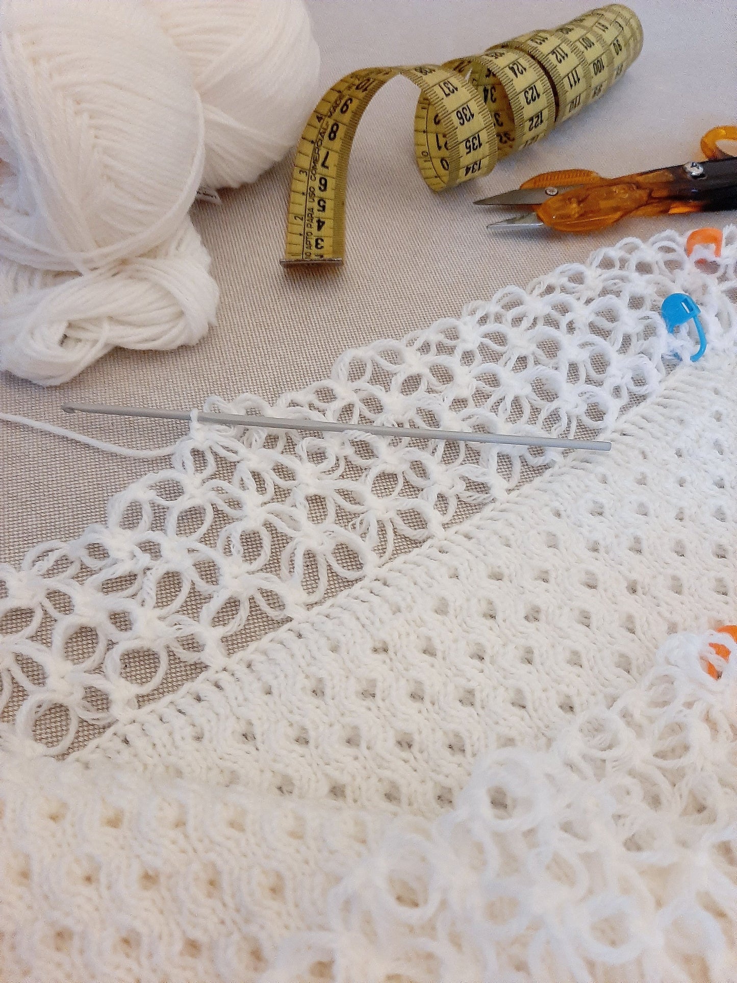 White honeycomb cover with witch stitch edge and blue ribbon