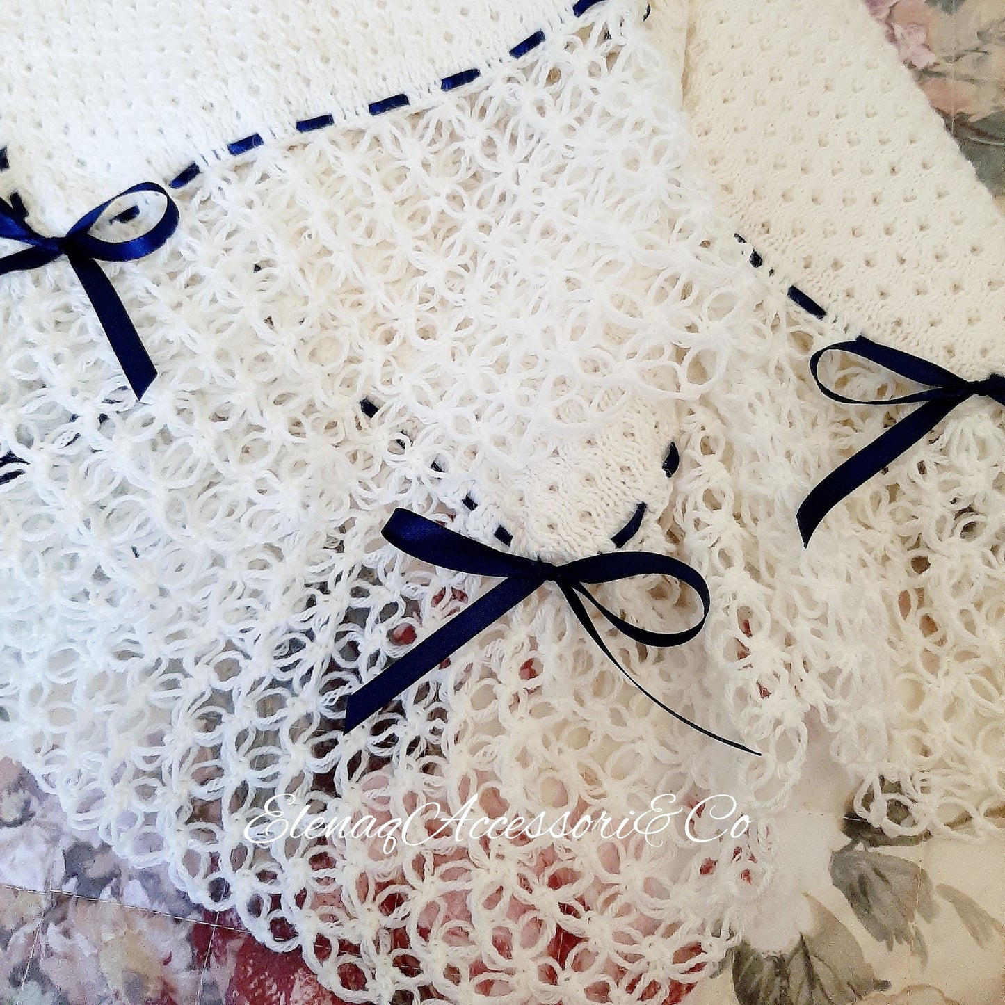 White honeycomb cover with witch stitch edge and blue ribbon