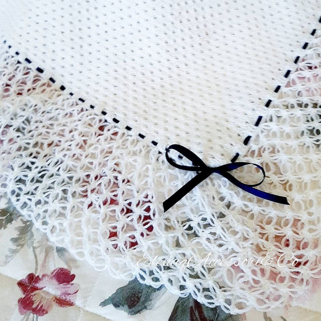 White honeycomb cover with witch stitch edge and blue ribbon
