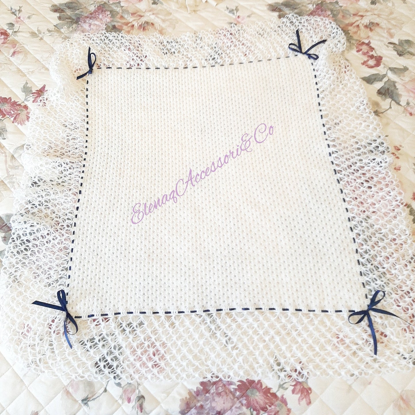 White honeycomb cover with witch stitch edge and blue ribbon